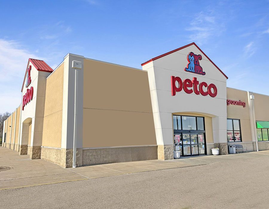 Front view of a Petco store with the brand logo and grooming services sign.