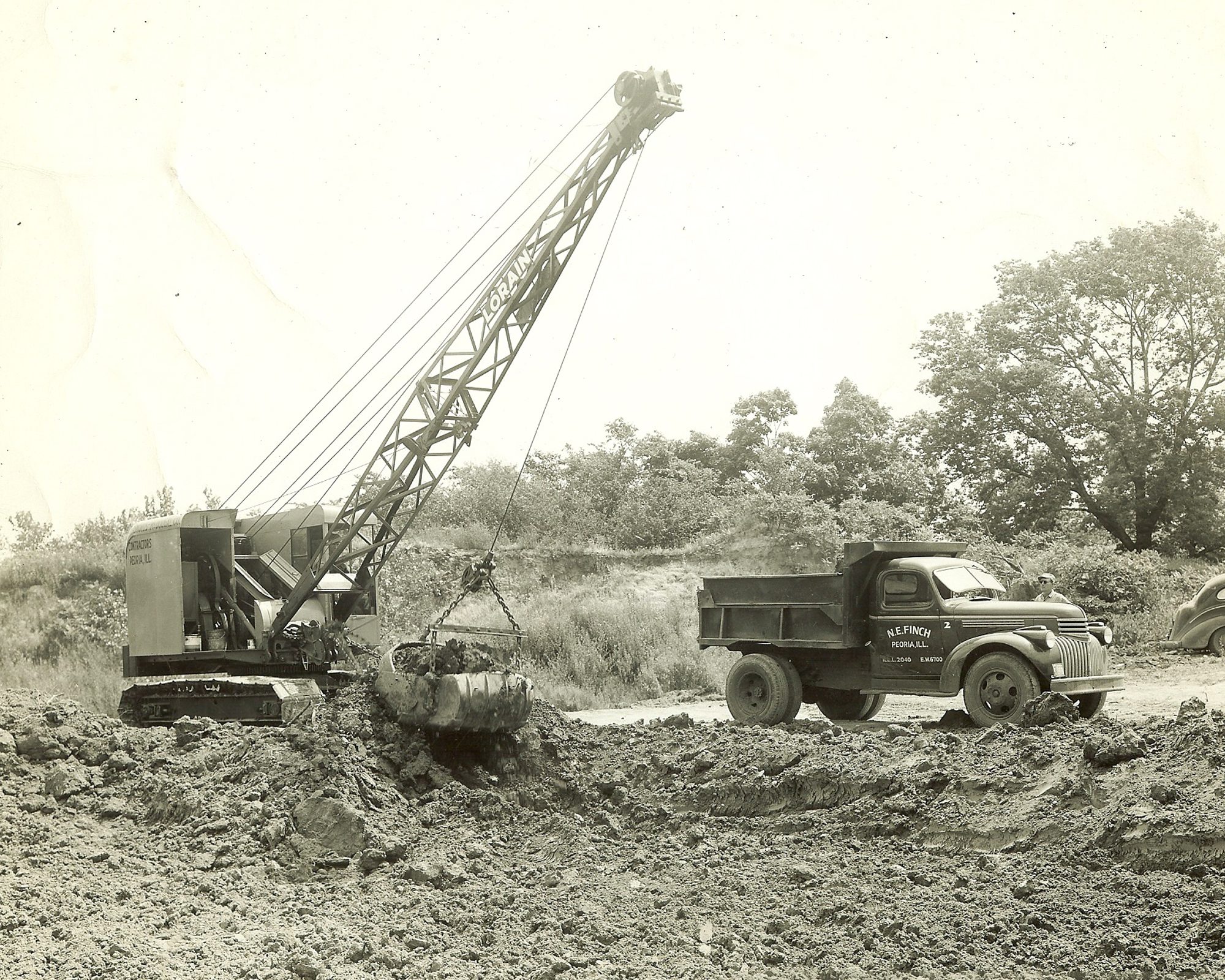 Peoria Metro | Black and white photos of an old truck and crane